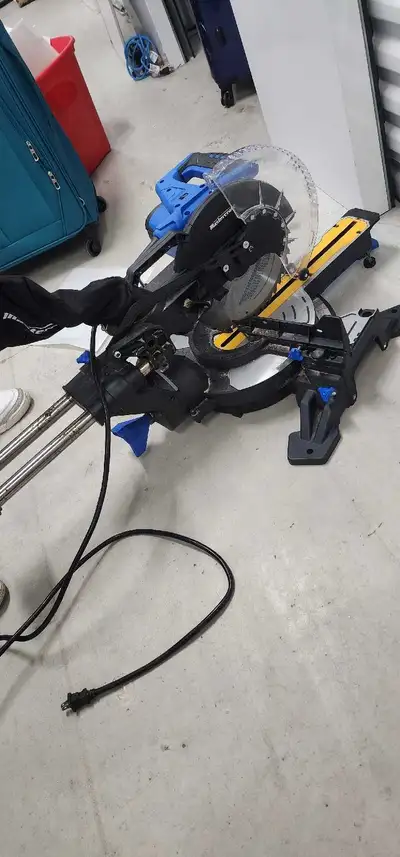 Selling my Mastercraft sliding meter saw with laser guide is power tool includes a clear plastic bla...