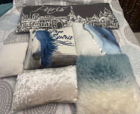 Decorative blue, white and grey pillows