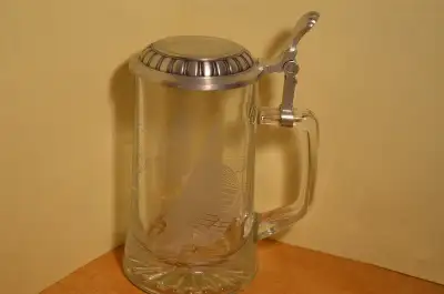 Beautiful etched glass stein with sailing images on front and back. Pewter top (95%). Never used. Be...