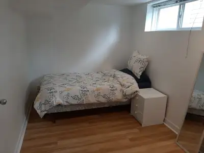 A furnished room for rent in a basement of a well maintained house. Female only. Shared accommodatio...