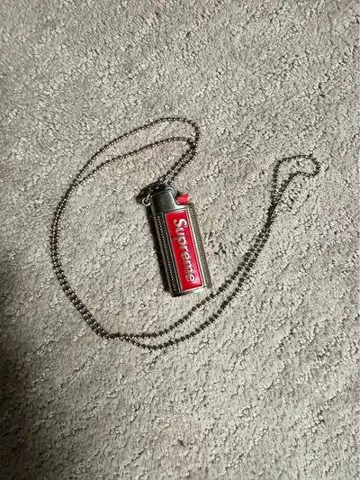Supreme Metal Lighter Holster made for holding your lighter - comes on a dog tag like necklace