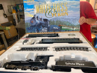 Large collection of G scale trains, engines, cars, and equipment