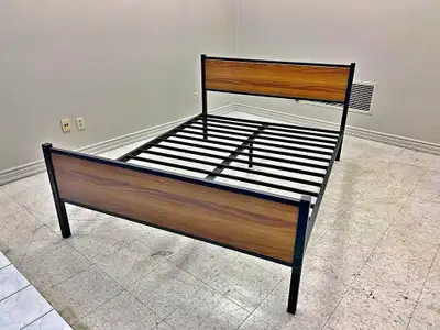 This is a used full-size bed frame, perfect for adding a touch of modern style to any bedroom. The f...