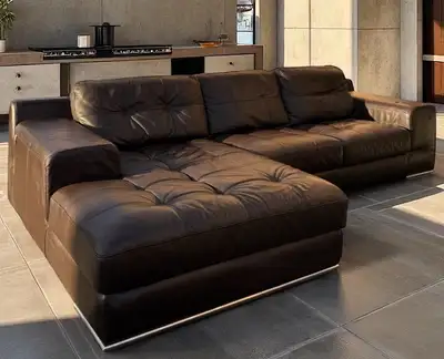 Sink into luxury with this genuine Natuzzi leather sectional, featuring a modern L-shape design that...