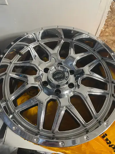 Used for only one season. Set of 4 American Racing wheels with center caps and lug nuts. Bolt patter...
