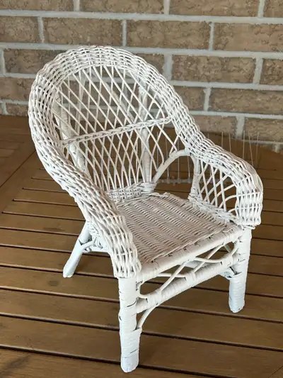 I have a used white wicker chair for a doll or a plant that is in good condition. The item is approx...