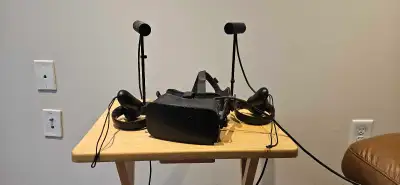 Oculus Rift CV1. Good condition, works. Comes with two sensors and two controllers. $100 OBO