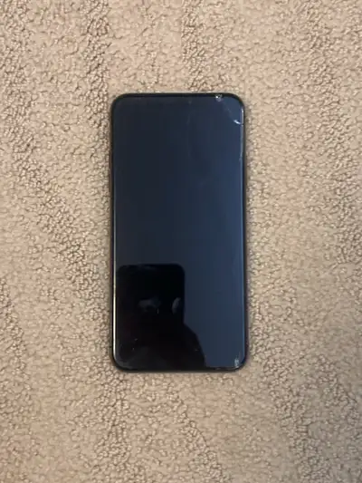 OBO. Looking to sell my old iPhone 11 Pro Max. Cracks on both the front and back as seen in the phot...