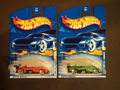 This lot includes a red First Editions (#21) and a green (#232) Panoz LMP-1 Roadster. The cards have...