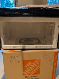 Over stove microwave with exhaust vent inside or outside