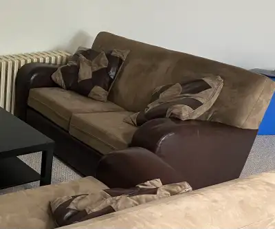 Matching pair of two-tone sofas, View more