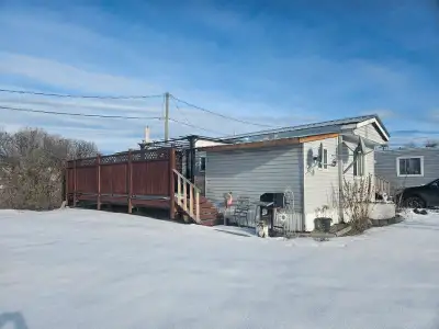 2 bedroom with like new kitchen appliances. Laundry room, boot room addition. Beautiful private deck...