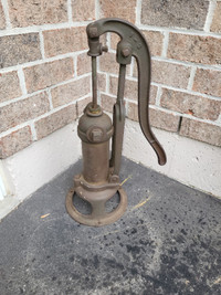 Antique cast iron and brass water pump