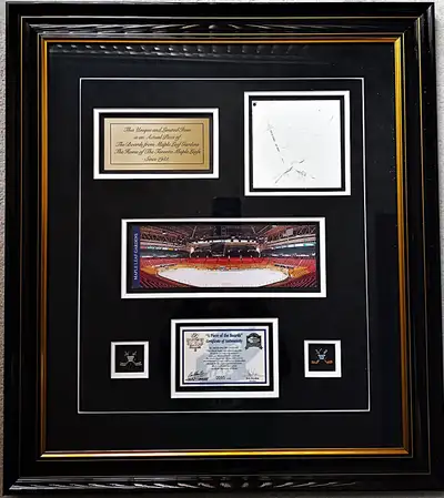 1) Maple Leaf Gardens framed piece of the boards with C.O.A. It measures approximately 27" x 25". 2)...