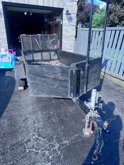 Utility trailer. Tows well and the lights work. Has a 4 x 8 bed. Fits a 1 7/8 ball. Frame is rusted...