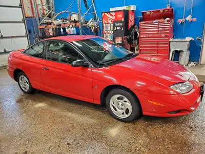 Certified 2001 Saturn SC1. Very reliable, air conditioned, extremely fuel efficient, fun to drive st...