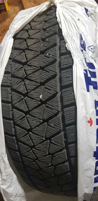 This is a SNOW tire taken off a Toyota Highlander that was sold for an upgrade. This tire is a Bridg...