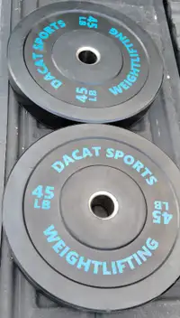 Dacat bumper plates 10s, 15s, 45, and barbell