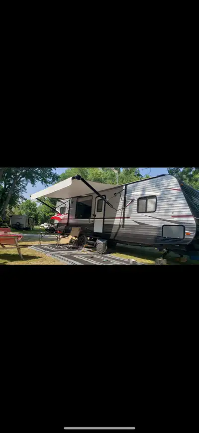 2018 Pioneer 32ft travel trailer L shaped kitchen with with large pull out pantry for storage locate...