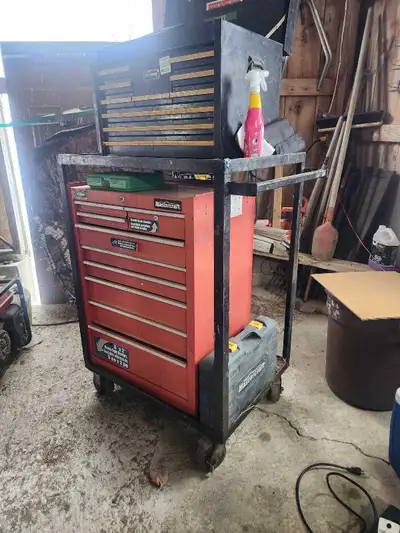 Heavy-duty rolling tool cart built from solid angle iron on large casters — extremely sturdy and eas...