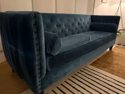 Blue suede sofa. Looking for a quick sell. No stains. Side pillows have flattened but overall lots o...