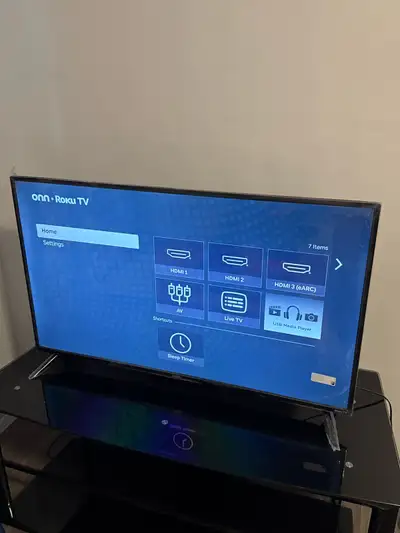 onn 43" 4K UHD HDR10 Smart Roku TV with table, View more