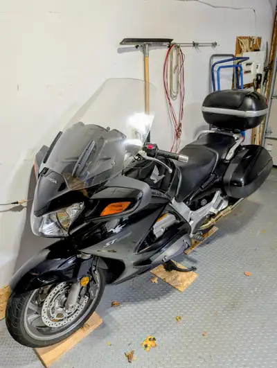 ST1300 in excellent condition. Side and Top Cases, Retractable Highway Pegs/Sliders, Heated Grips, A...