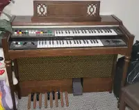 Yamaha organ piano with stool and many books