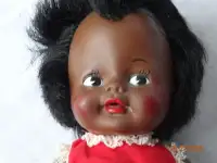Doll, 12 inch brown skinned baby,stencil brown eyes, orig. dress