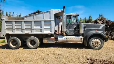 1992, Western Star dump truck. 12,000 front, 40,000 rear, Cat 425hp, 18 speed Eaton. Hoist has no le...