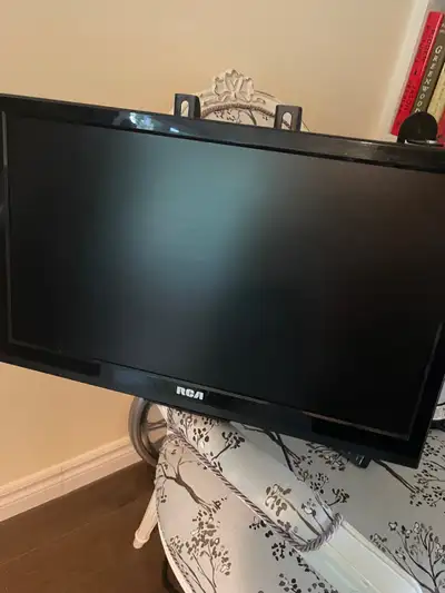19’ RCA TV with remote, on heavy duty retractable wall mount , View more