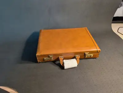Helping parents condense their belongings. Old Renwick Briefcase that has seen use but could still h...