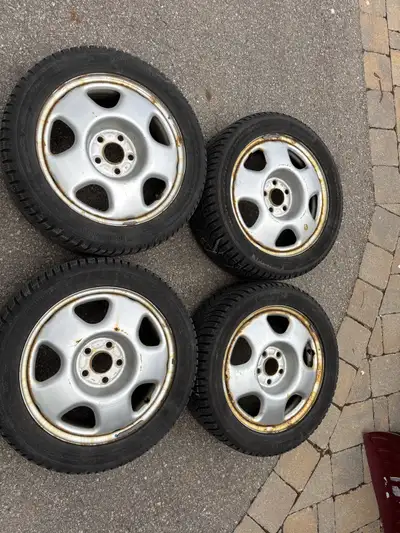 Selling a set of four Honda OEM wheels with Continental winter tires, which are in used condition (d...