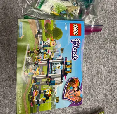 Get ready to build with this Lego Friends 41338 Sports Arena set, featuring a basketball court, tenn...