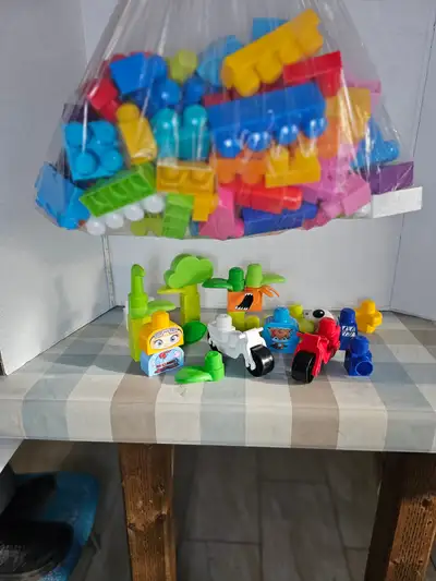 This Mega Bloks building set includes colorful blocks, vehicles, and character figures, perfect for...