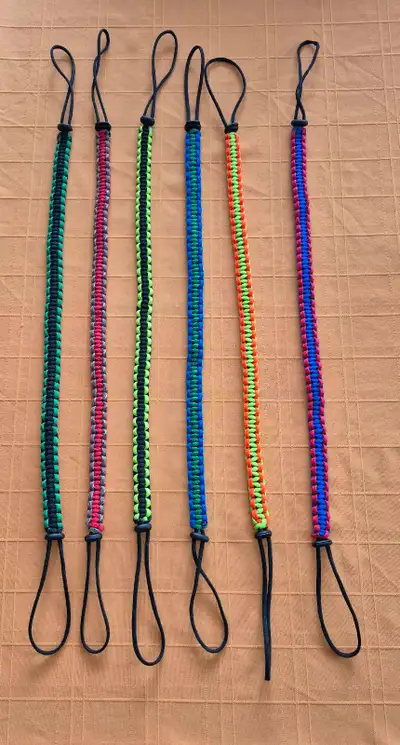 Wild Turkey tote for harvested game. Custom made from paracord. Put head in one adjustable loop, fee...