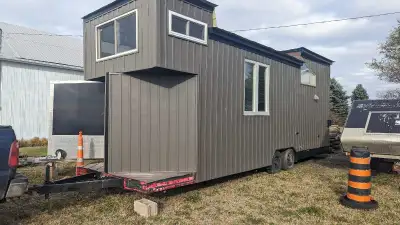 Custom 28x8 tiny home / office trailer with two lofts. I bought it in 2022 with just the siding and...