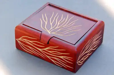 Available is a small (approx. 5" wide) trinket / jewel / knick knack box made from mango wood in Cos...