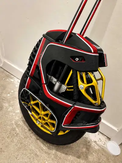 This is a pre-owned Begode Master electric unicycle, featuring advanced suspension and a striking re...
