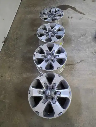 Set of 4 original 18-inch Ford F150 aluminum wheels. Structurally perfect (no cracks or bends), but...