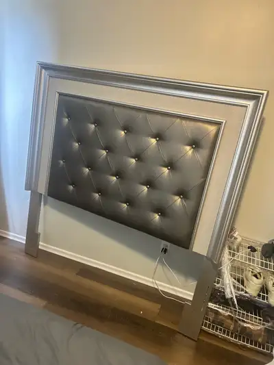 Beautiful silver bed frame with tufted cushioned headboard and modern luxury design. Very sturdy and...