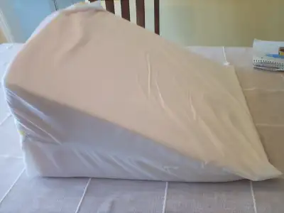 wedge, foam, slant, pillow many possible uses--upright to read, down to sleep, under knees removable...