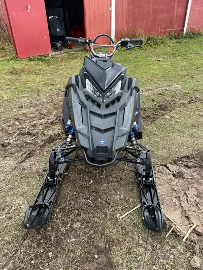 Great sled runs awesome just never got time to use it , also comes with black Jerry can that clips o...