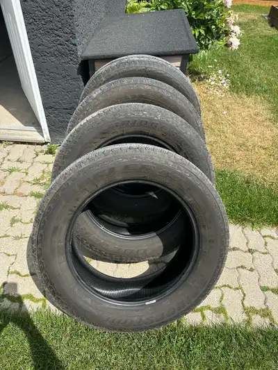 Bridgestone Dueler H/T 265/60r20 112h m+s Came off a 2025 Tundra pickup. 4692km on them. Like new Sw...