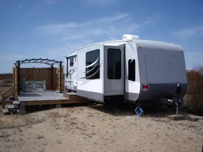 Trailer is located in Misty Meadows at Candle Lk. Couples trailer with 3 slide outs, deck and 8 x 12...