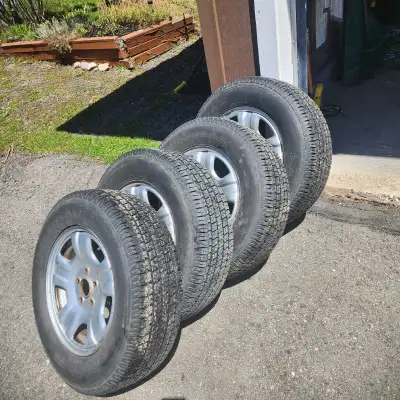 Great condition Uniroyal Laredo 4-season tires mounted on silver 5-spoke rims. Tires have 9/32nd tre...