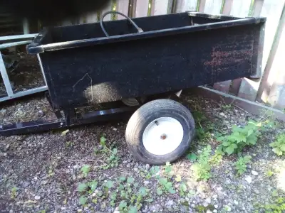 Yard tilt trailer almost new price tag still on it everything works don't need it $50 call my tempor...