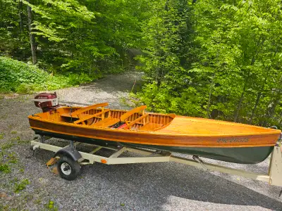 STILL AVAILABLE. Classic cedar strip boat in pristine condition with Johnson 15 HP motor. Trailer an...