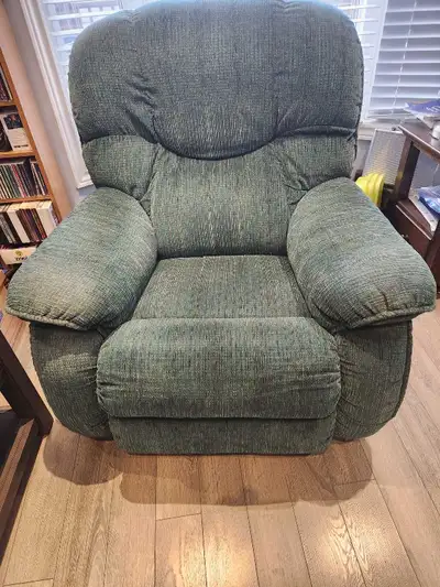 This is a comfy, Lazy Boy Rocker Recliner, perfect for any living room or den. It features a sturdy...