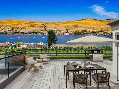 Features • Private rooftop garden with panoramic lake and mountain views • Spacious open-concept liv...